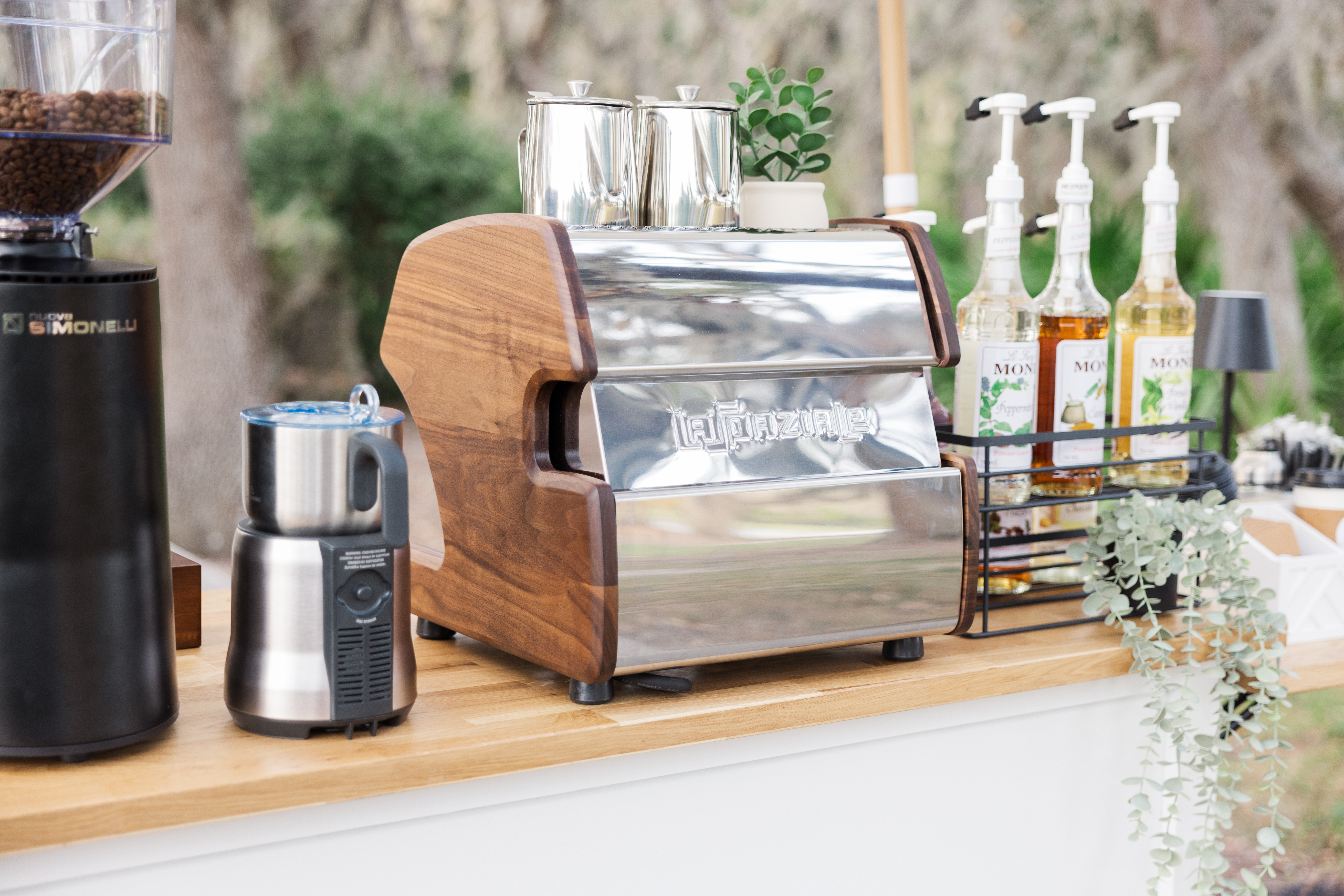Delightful Bean coffee cart setup with espresso machine, grinder, and syrups in Davis Island